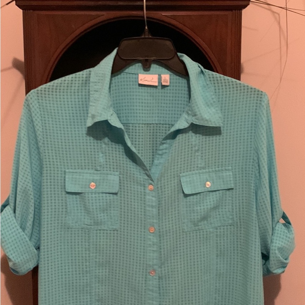 Kim Rogers’s, beautiful button down , rolled sleeves